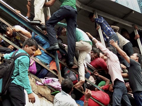 Passengers caught in a stampede at Elphinstone railway station's foot over bridge in Mumbai on Friday. | PTI