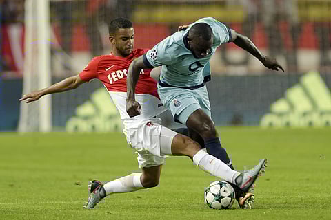 Monaco's Jorge, left, and Porto's Moussa Marega challenges for the ball during their Champions League Group G first leg soccer match between Monaco and FC Porto at Louis II stadium in Monaco. | AP