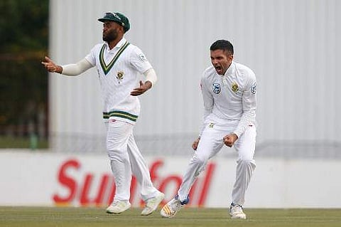 South African bowler Keshav Maharaj (R) celebrates the dismissal of Bangladesh batsman Mushfiqur Rahim (not in picture) during the second day of the first Test Match between South Africa and Bangladesh on September 29, 2017. | AFP