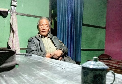 Nar Bahadur Mukhia with a Chinese porcelain tea cup.