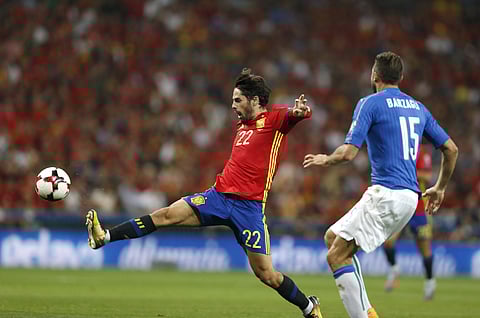 Spain's Isco fights for the ball against Italy's Andrea Barzagli during the World Cup Group G qualifying soccer match between Spain and Italy. (Photo | AP)