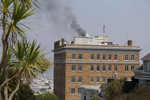 Black smoke rises from the roof of the Consulate-General of Russia Friday, Sept. 1, 2017, in San Francisco. The U.S. on Thursday ordered Russia to shut its San Francisco consulate and close offices in Washington and New York within 48 hours in response to