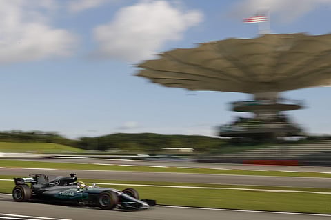Mercedes driver Lewis Hamilton of Britain steers his car during the 2nd qualifying run at the Sepang International Circuit for the Malaysian Formula One Grand Prix in Sepang, Malaysia. | AP