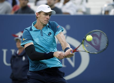Kevin Anderson, of South Africa, returns a shot from Paolo Lorenzi, of Italy, during the fourth round of the U.S. Open tennis tournament. | AP