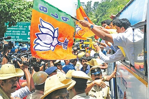 BJP leaders and party workers shout slogans against the state government after their bid to take out a bike rally from Freedom Park was thwarted by the police in Bengaluru on Tuesday | express