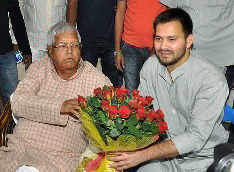 Lalu Prasad Yadav with son Tejaswi Yadav . (File photo by PTI)