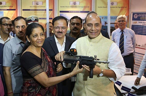 Defence Minister Nirmala Sitharaman and Home Minister Rajnath Singh having a feel of carbine indigenously produced by Ordnance Factory handed over to paramilitary forces for user trials. (Express Photo Service | Shekhar Yadav)