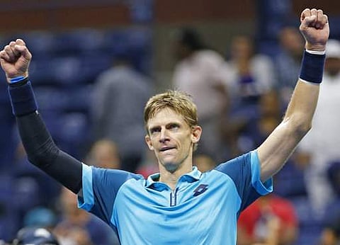 Kevin Anderson, of South Africa, reacts after defeating Sam Querrey, of the United States, in a quarterfinal match at the U.S. Open tennis tournament in New York. | AP
