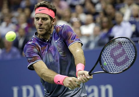 Juan Martin del Potro, of Argentina, hits a backhand to Roger Federer during the quarterfinals of the U.S. Open tennis tournament in New York. ( Photo | AP )