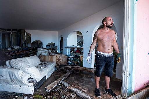 A man reacts as stands in his destroyed home on September 7, 2017 in Orient Bay on the French Carribean island of Saint-Martin, after the passage of Hurricane Irma. (Photo | AFP)