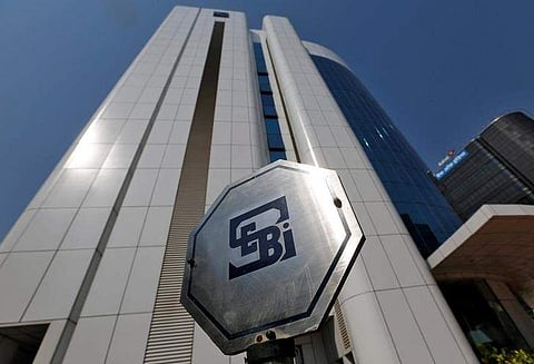 The logo of the Securities and Exchange Board of India (SEBI) is pictured on the premises of its headquarters in Mumbai. (File Photo | Reuters)