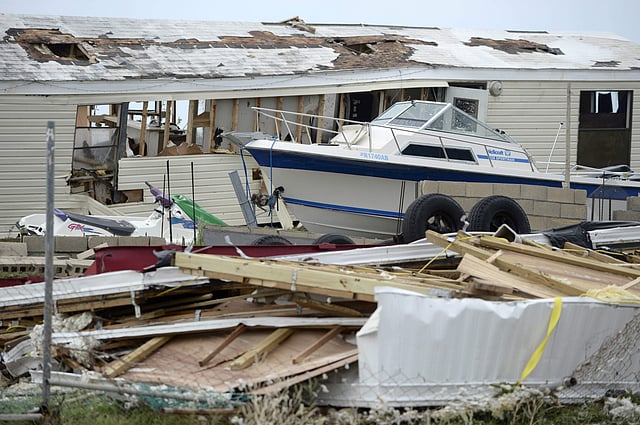 A pleasure boat stands next to a destroyed home after the passing of Hurricane Irma, in Culebra, Puerto Rico. (Photo | AP)