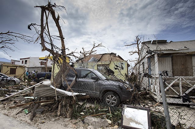 People gathered outside their house after the storm to see the destruction caused by Hurricane Irma. (Photo | Dutch Defense Ministry via AP)