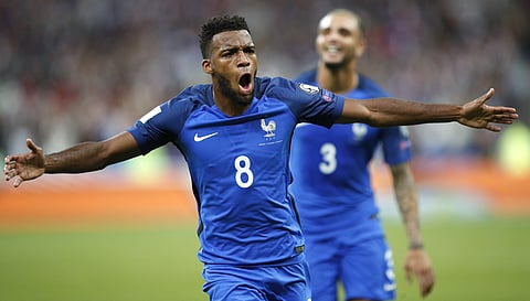 France's Thomas Lemar reacts after scoring France' s second goal during the World Cup Group A qualifying soccer match between France and The Netherlands at the Stade de France stadium. | AP