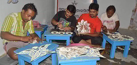 Workers designing parts of the tableau for the Dargha Bazaar medha in Cuttack on Friday | Express