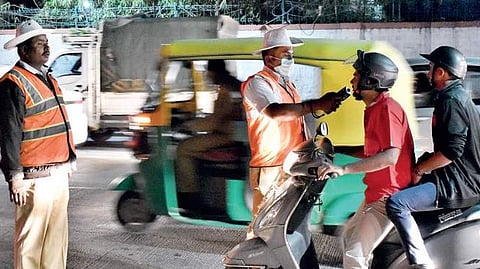 Traffic police checking for drunk driving.