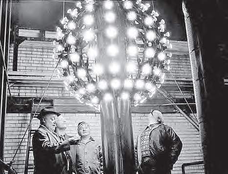 Technicians eye the new improved New Year’s ball in New York in 1978 | The Times Square Alliance