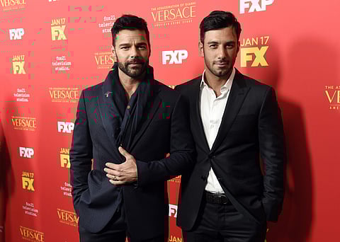 Ricky Martin, left, a cast member in 'The Assassination of Gianni Versace: American Crime Story,' poses with his partner Jwan Yosef at a special screening of the television series at the ArcLight Hollywood on Monday, Jan. 8, 2018, in Los Angeles. (Photo |