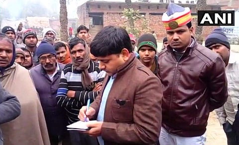 In this photo, an investigation team is seen at the Thal Khurd village for further probe over the death of 9 who died of alleged alcohol poisoning. (Photo | ANI)