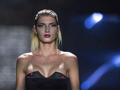 Model Giuliana, who became well known with the show 'Germany's Next Topmodel,' appears during a fashion show in Berlin. (Photo: AP)