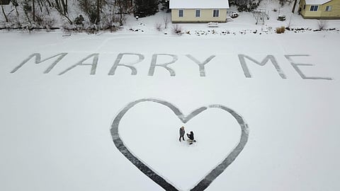 A lofty proposal: 'Marry Me' etched in snow, seen from above