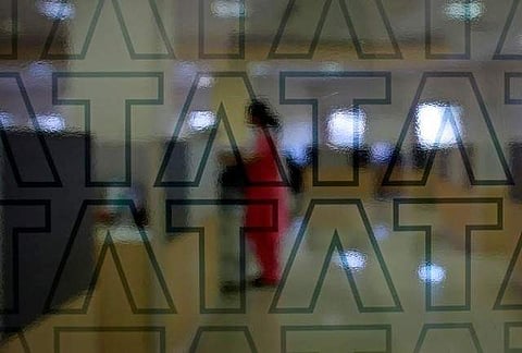 An employee of Tata Consultancy Services (TCS) works inside the company headquarters in Mumbai. (File | Reuters)
