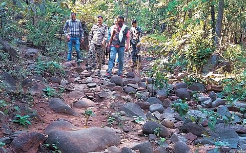 Kanker police and villagers surveying routes to carve out the road.