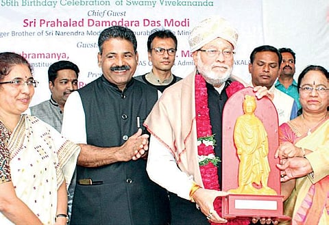 PM Narendra Modi’s younger brother Prahlad Modi being felicitated during a  Adamya Chetana Trust programme in Bengaluru on Friday | Express