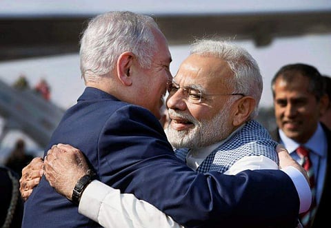 PM Modi hugs Israel PM Benjamin Netanyahu upon his arrival in New Delhi on January 14. (PTI Photo)