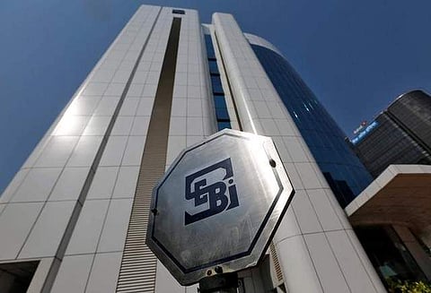 The logo of the Securities and Exchange Board of India (SEBI) is pictured on the premises of its headquarters in Mumbai. (Photo | Reuters)