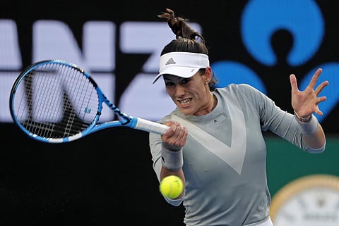Spain's Garbine Muguruza makes a forehand return to France's Jessika Ponchet during their first round match at the Australian Open | AP