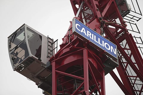 A crane bearing the name of Carillion, at a construction site in central London, Monday Jan. 15, 2018, as the construction and services giant Carillion has gone into liquidation. (Associated Press)
