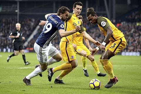 West Bromwich Albion's Jay Rodriguez, left, battles for the ball with Brighton & Hove Albion's Lewis Dunk and Gaetan Bong.(Photo | AP)