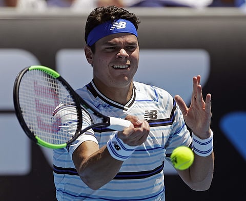 Canada's Milos Raonic makes a forehand return to Slovakia's Lukas Lacko during their first round match at the Australian Open. | AP