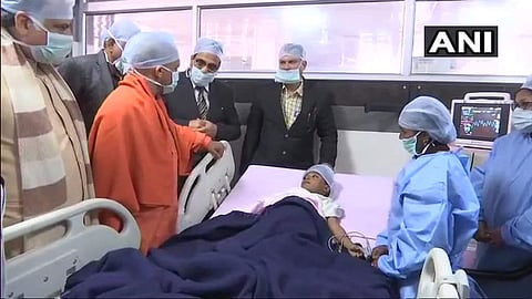 UP CM Yogi Adityanath met the student of Class 1 of Brightland School who was injured after another student attacked him. (ANI)