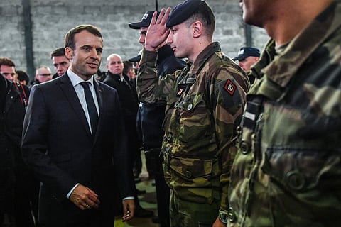 French President Emmanuel Macron speaks with soldiers during his visit to Calais, northern France, Tuesday, Jan.16, 2018. (Photo | Associated Press)