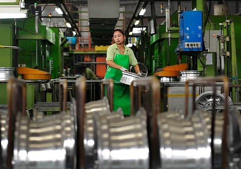 The economy is in the process of rebalancing away from the investment-heavy and export-dependent model that brought four decades of breakneck economic growth but left China heavily in debt. (File | ASsociated Press)