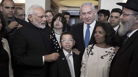 Prime Minister Narendra Modi and Prime Minister Benjamin Netanyahu meet with Moshe Holtzberg and his nanny who saved him. (AFP Photo)