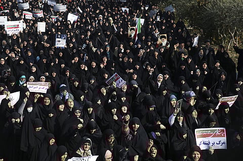 Iranian protesters chant slogans at a rally in Tehran. (Photo | AP)