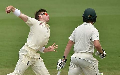 England's spinner Mason Crane (L) bowls to Cricket Australia XI batsman Matthew Short as Will Pucovski (R) looks on during the first day of a four-day Ashes tour match at the Tony Ireland Stadium in Townsville on November 15, 2017. | AFP