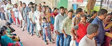 People standing in queue at General Hospital in Thiruvananthapuram to get OP tickets. IMA had declared Black Day and struck work in protest  for one hour at General Hospital as part of opposing the National Medical Commission Bill in Parliament—  Manu R M