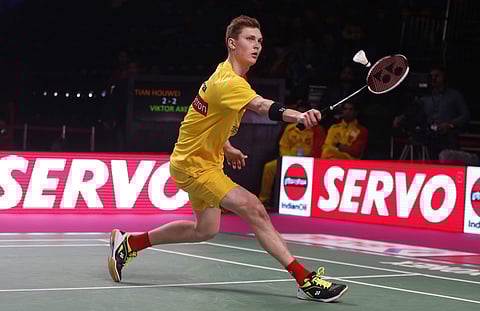 Denmark player Viktor Axelsen of Bengaluru Blasters returns a shot to Chinese player Tian Houwei of Delhi Dashers during the men's singles of Vodafone Premier Badminton League (PBL) in New Delhi. | AP