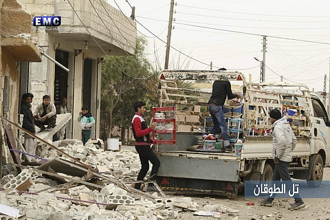 Syrian citizens load their belongings at a pickup, as they flee their house. (Photo | AP)