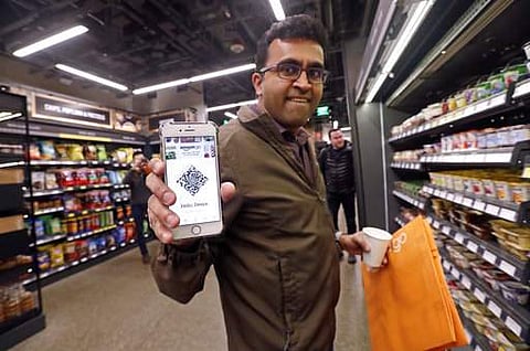 The online retailer opened its 'future of store shopping' concept to the public yesterday in Seattle with its first Amazon Go store, which lets shoppers take milk, potato chips or ready-to-eat salads off its shelves and just walk out. The store allows shoppers to scan their smartphone with the Amazon Go app at a turnstile, pick out the items they want and leave. It can tell what people have purchased and automatically charges their Amazon account| AP Photo