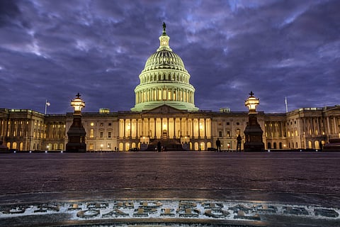 In this file photo, lights shine inside the U.S. Capitol Building as night falls in Washington, Sunday, Jan. 21, 2018 and Congress continues to negotiate during the second day of the federal government shutdown. (Photo | Associated Press)
