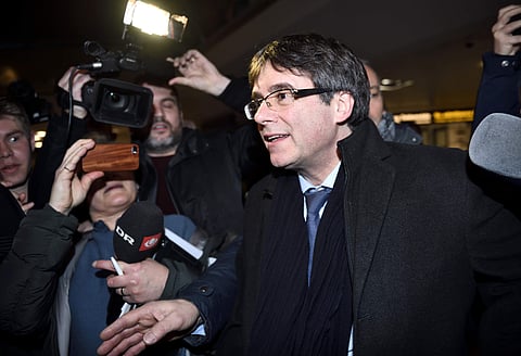 Ousted Catalan leader Carles Puigdemont, left, arrives in Copenhagen on Monday, Jan. 22, 2018. (AFP)