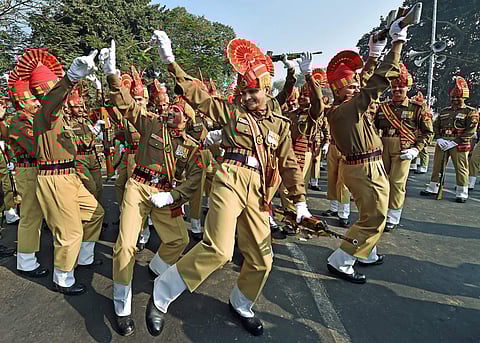 Cadets of Sashastra Seema Bal share a lighter moment during full dress rehearsal for Republic day parade in Kolkata. (Photo | AP)
