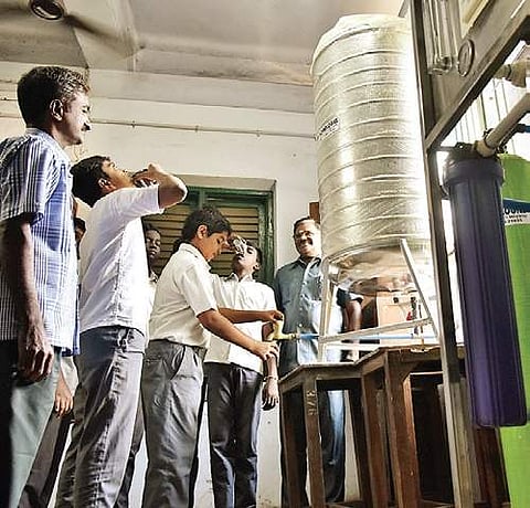 Headmaster R Nedumaran with students