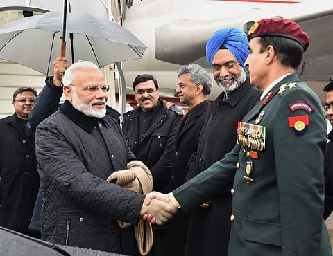 Prime Minister Narendra Modi greets the officials on his arrival at Zurich International Airport to participate in the World Economic Forum in Davos on 22, January 2018. (Photo | PTI)