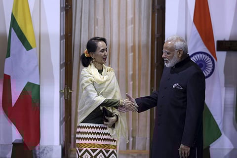 Myanmar State Counsellor Aung San Suu Kyi, left, and PM Narendra Modi pose for the media ahead of their meeting in New Delhi, India. | AP
